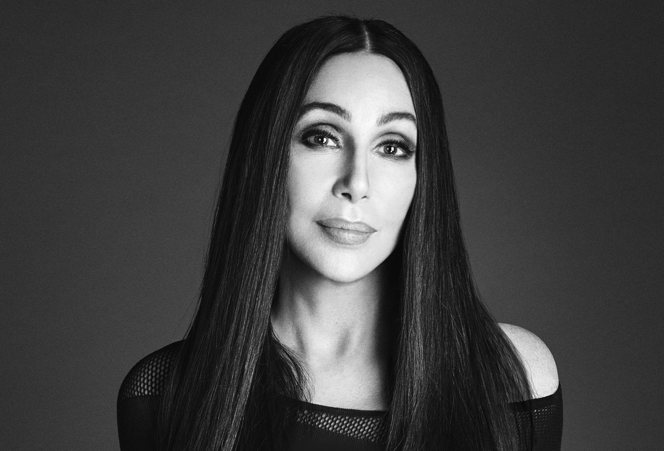Black and white portrait photo of Cher