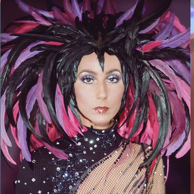 Cher wearing a feathered headdress